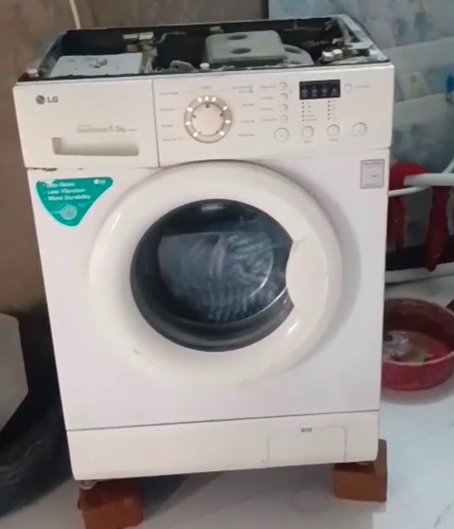 Real front-load washing machine under repair in Jaipur